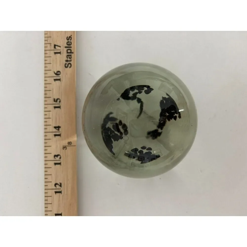 Vintage art glass paperweight with black Inclusions